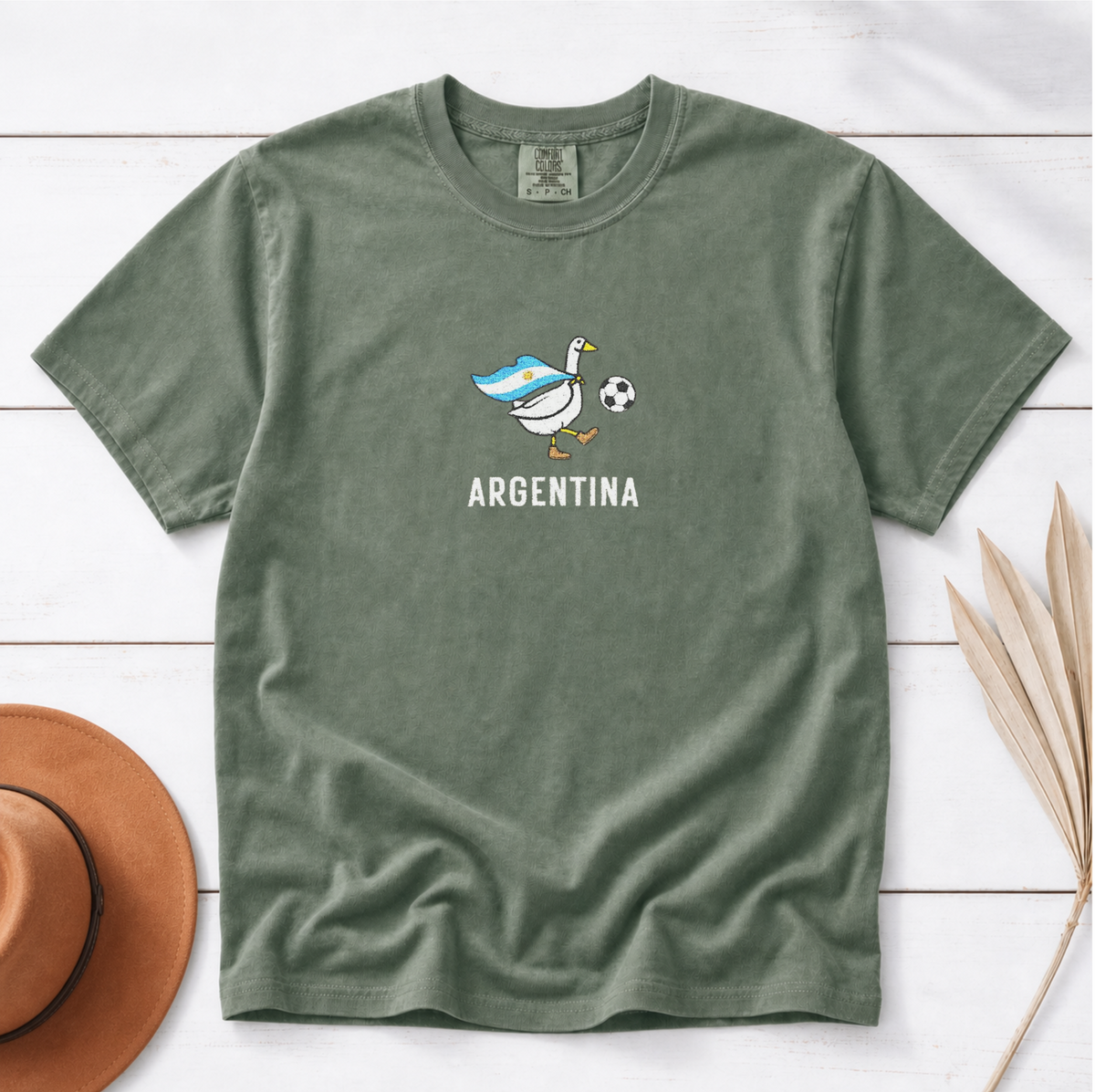 Embroidered Argentina Soccer Goose Shirt – Moss flat lay