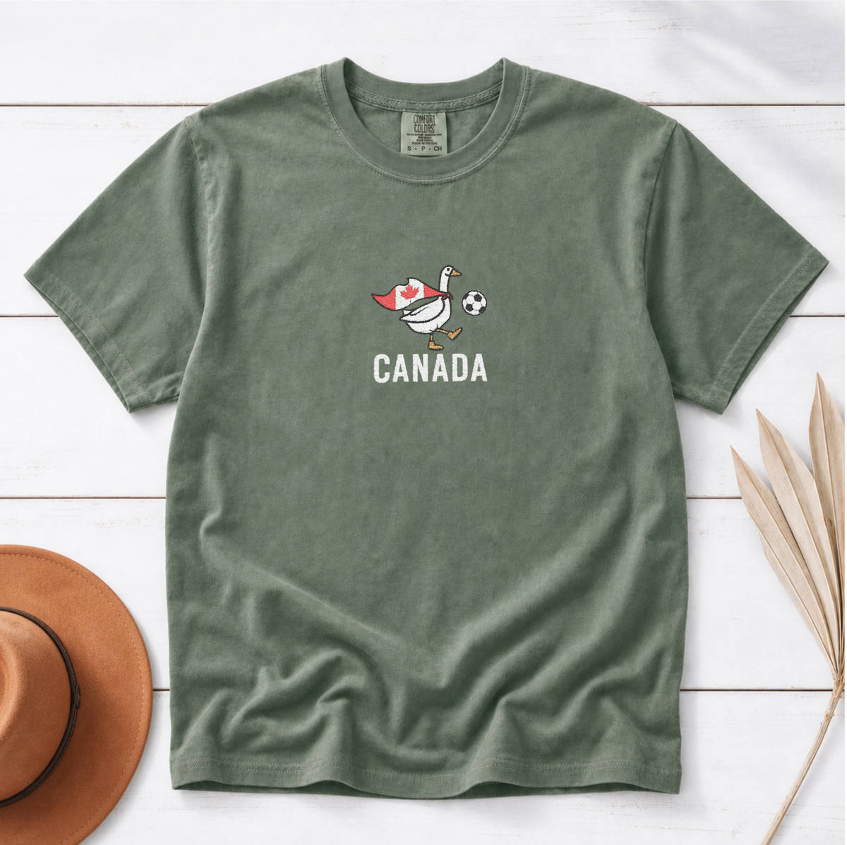 Embroidered Canada Soccer Goose Shirt – Moss flat lay