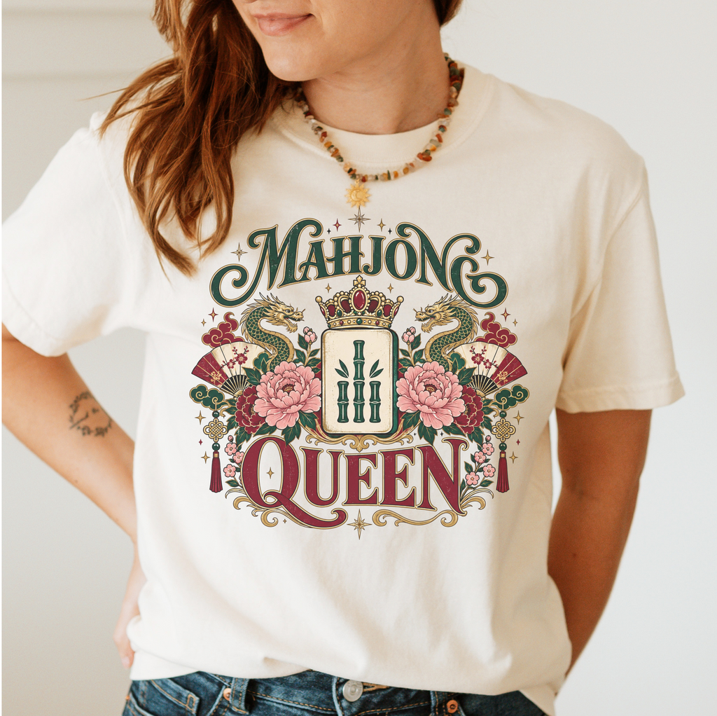 Mahjong Queen Shirt in Violet - QUEEN and MAHJONG lettering with two red dragons and a jeweled crown in a teal frame