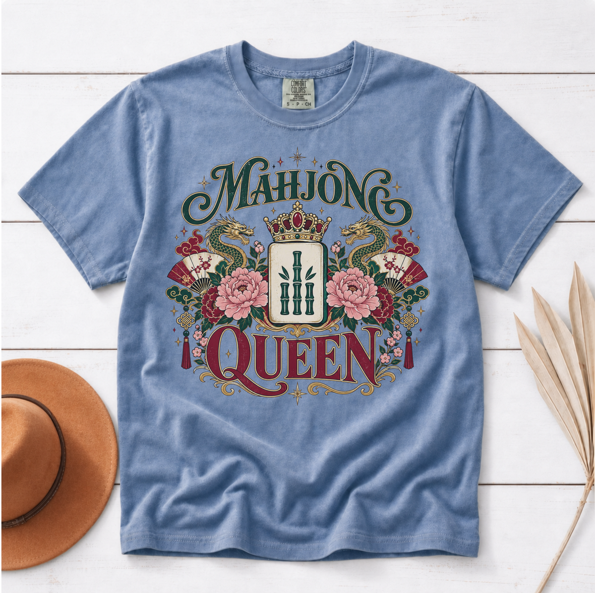 Mahjong Queen Shirt in White - QUEEN and MAHJONG lettering with two red dragons and a jeweled crown in a teal frame