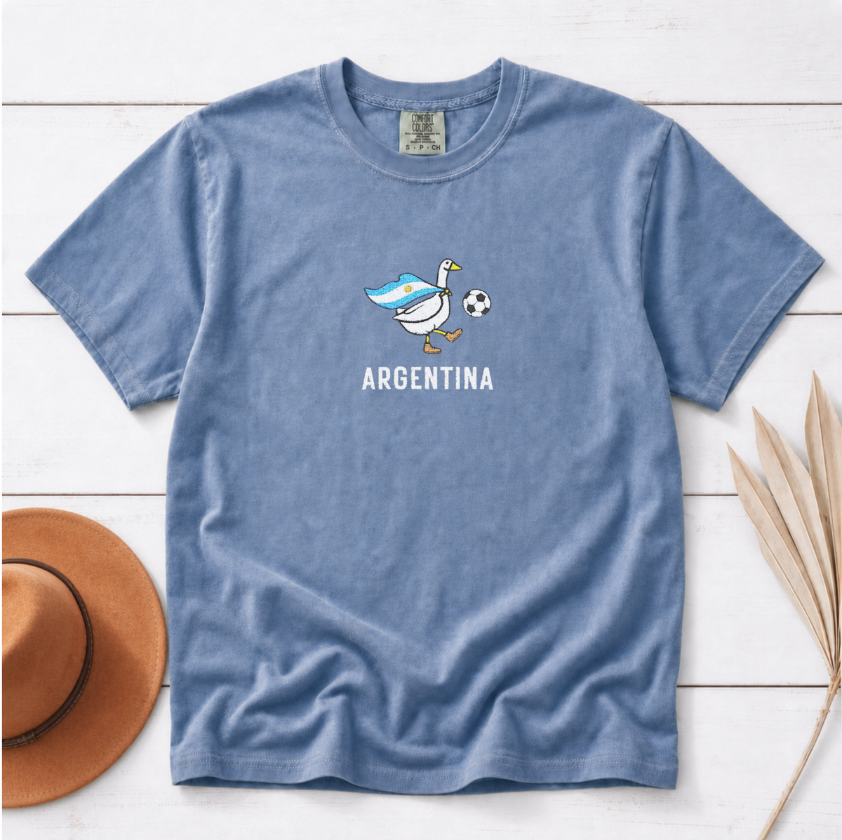 Embroidered Argentina Soccer Goose Shirt – Jean Blue flat lay