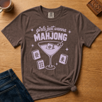 Girls Just Wanna Mahjong Shirt in Pepper - pink lettering and a martini glass with a mahjong tile on a folded dark grey Comfort Colors 1717 tee, styled flat lay