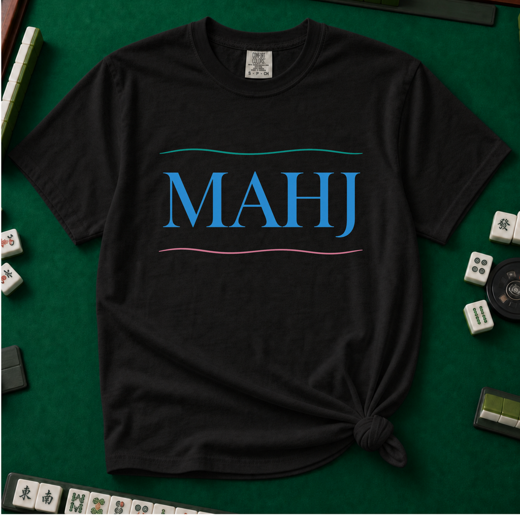 MAHJ Wave T-Shirt in Black, knotted flat lay on a green mahjong mat - "MAHJ" in sky-blue serif letters between a teal wave line above and a pink wave line below