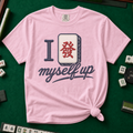 I Set Myself Up T-Shirt in Blossom, knotted flat lay on a green mahjong mat - a stitched-look varsity rebus - a navy letter I beside a cream fa dragon tile with the red character, over "myself up" in navy script