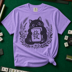 Linocut Tile Cat T-Shirt in Violet, knotted flat lay on a green mahjong mat - a linocut-style black cat hugging a Green Dragon mahjong tile inside a wreath of wheat, daisies and lavender