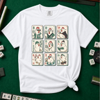 Mahjong Chicken Tiles T-Shirt in White, knotted flat lay on a green mahjong mat - a 3x3 grid of mahjong tiles, each starring a cartoon chicken with its own personality - varsity jacket, karate gi, cape, beanie, headphones, bookworm glasses, cherry blossom, pool floatie and skateboard