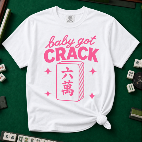 Baby Got Crack Shirt in White - knotted tee on a light surface with mahjong tiles scattered around, printed with the words Baby Got Crack, Crack in big pink letters, with three small mahjong tiles