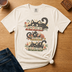 Retro Black Cats Mahjong Shirt in Violet - three black cats over a row of mahjong tiles with arched MAHJONG lettering