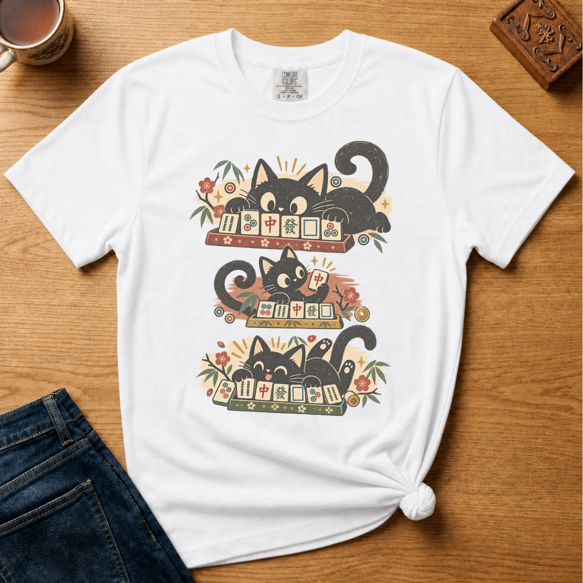 Retro Black Cats Mahjong Shirt in White - three black cats over a row of mahjong tiles with arched MAHJONG lettering