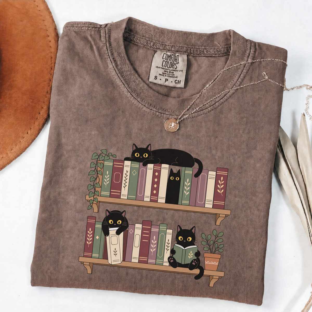Espresso Comfort Colors book-lover shirt featuring black cats among colourful bookshelves
