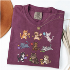Berry graphic T-shirt with nine cartoon cats playing pickleball