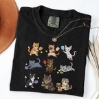 Black graphic T-shirt with nine cartoon cats playing pickleball