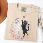 Ivory Comfort Colors Halloween shirt featuring a floral ghost and black cat dancing together