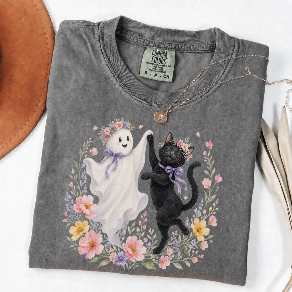 Pepper Comfort Colors Halloween shirt featuring a floral ghost and black cat dancing together