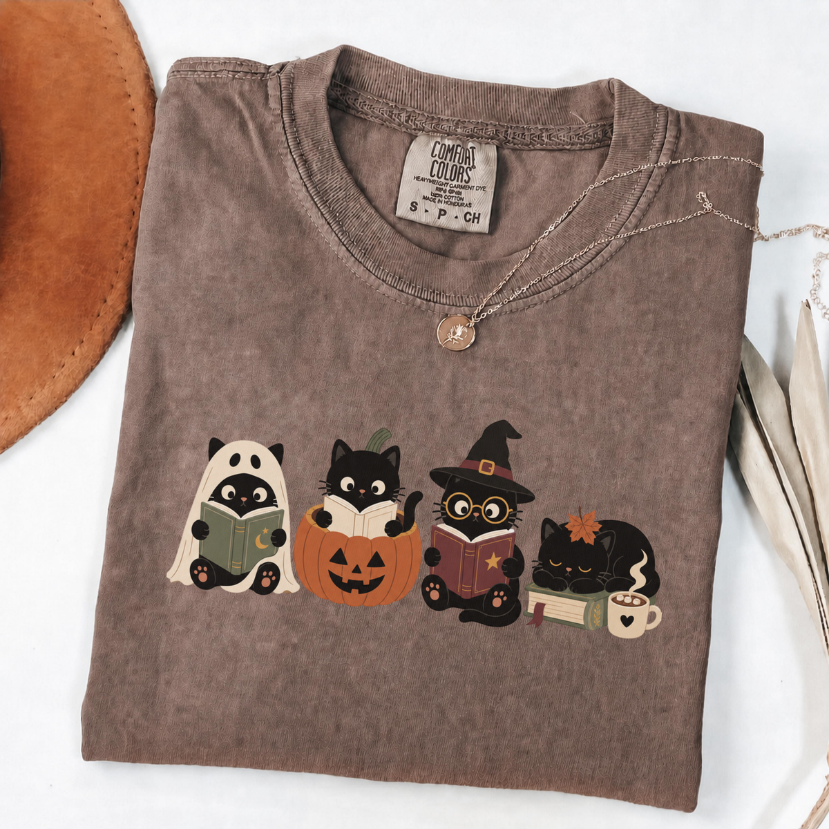 Espresso Comfort Colors Halloween shirt featuring four black cats reading books in spooky costumes