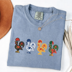 Blue Jean garment-dyed T-shirt featuring four colorful Portuguese folk-art roosters in a row