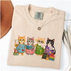 Ivory T-shirt with four cartoon cats dressed as colorful pre-K teachers.