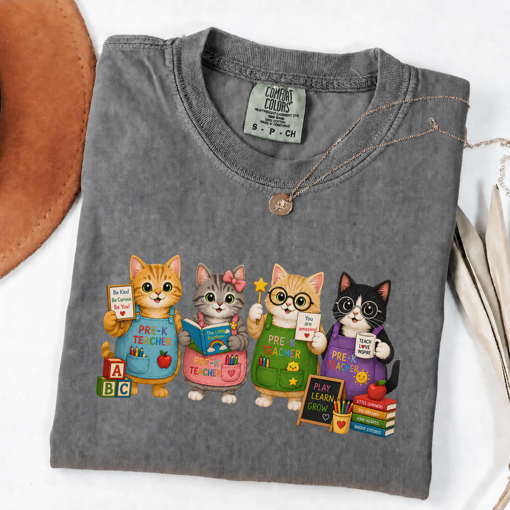 Pepper T-shirt with four cartoon cats dressed as colorful pre-K teachers.