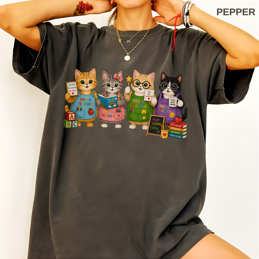 For an actual modeled product image: Adult wearing the relaxed-fit pre-K teacher cat shirt in the selected colour.