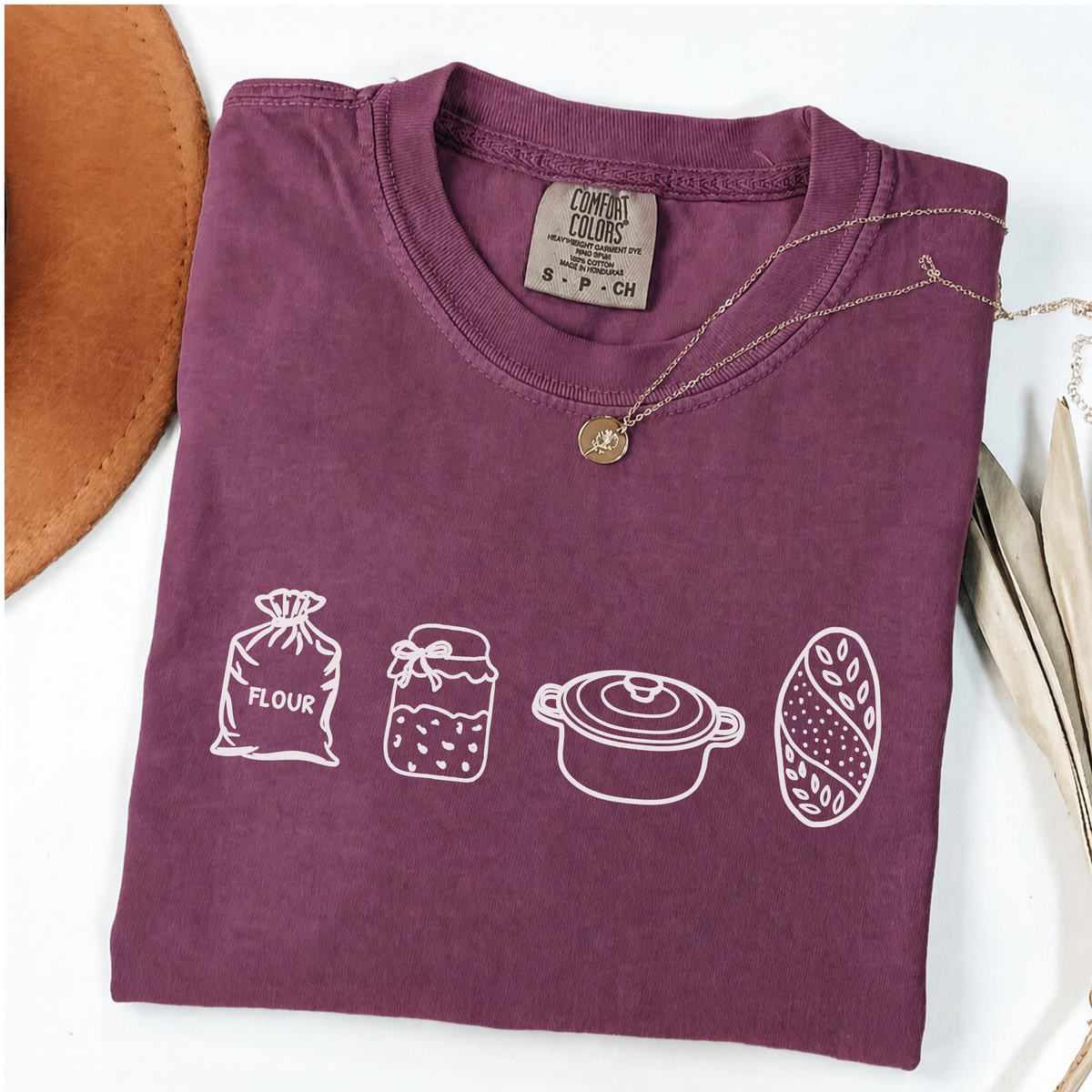 Berry sourdough baker shirt with flour, starter, Dutch oven and bread illustrations.