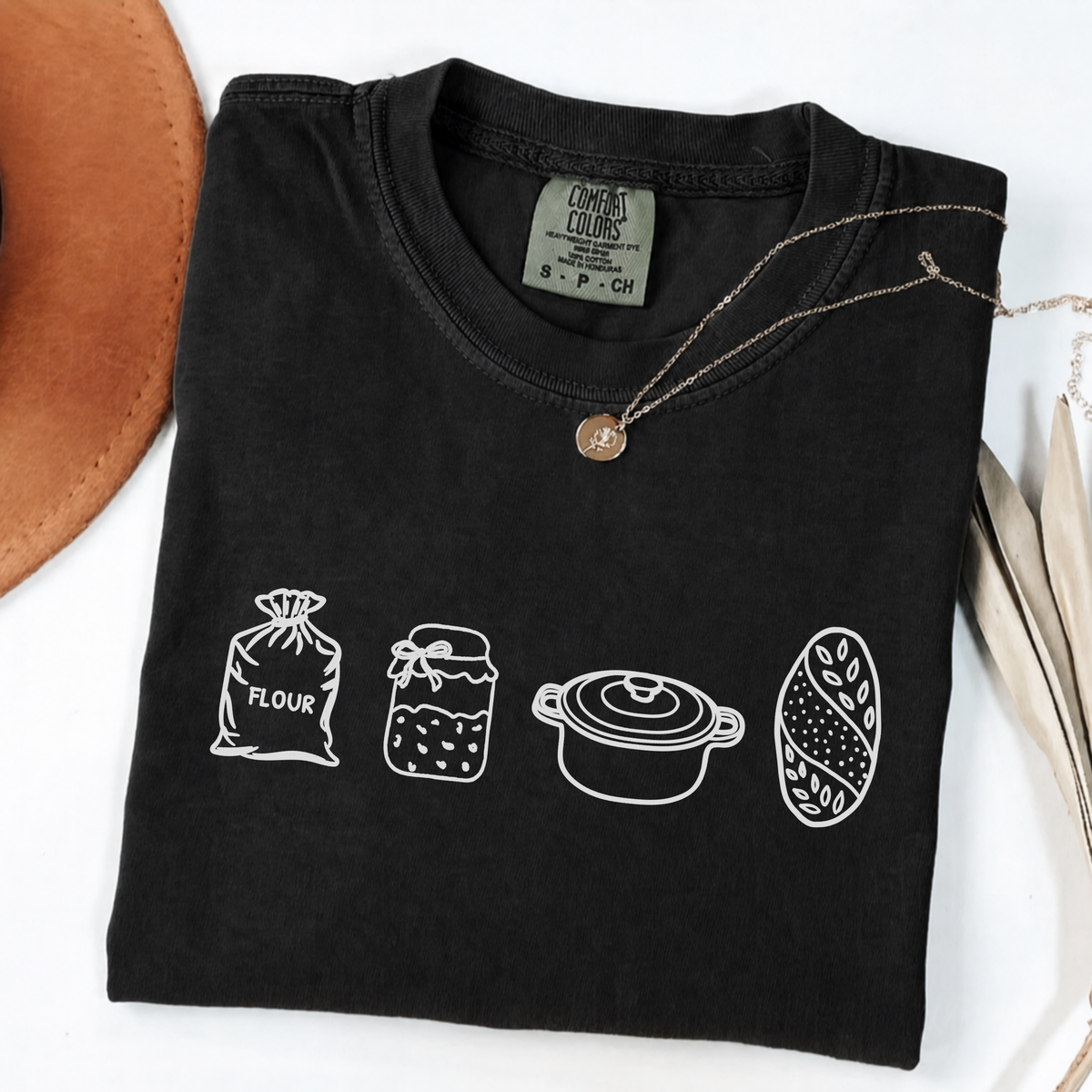 Black sourdough baker shirt with flour, starter, Dutch oven and bread illustrations.